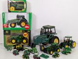 a lot of toy tractors that are sitting on a table