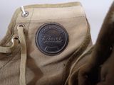 a close up of a pair of shoes with a shoe tag on it