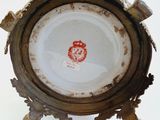 a close up view of a vase with a crown on it