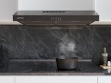 a stove top with a pot on it in a kitchen