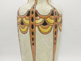 a vase that is sitting on a white surface