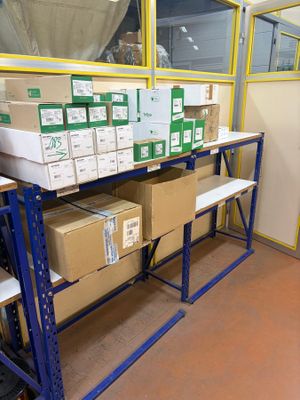 boxes and boxes on a shelf in a warehouse