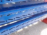 a blue bench that has holes in it