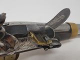 a close up of a gun that is on a table