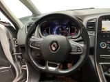 the interior of a car with a steering wheel and dashboard controls