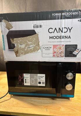 a box that has a microwave on top of it