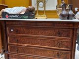 a man laying on top of a dresser in a room