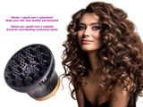a woman that is blow drying her hair with a hair dryer