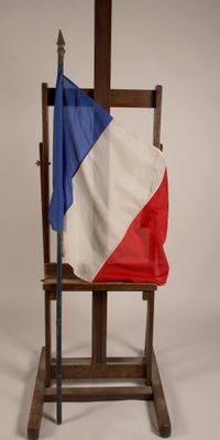 a chair with a flag on it and a flag on the back of the chair