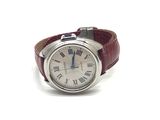 a wrist watch with roman numerals on it