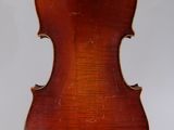 an old violin with a wooden back and a long neck