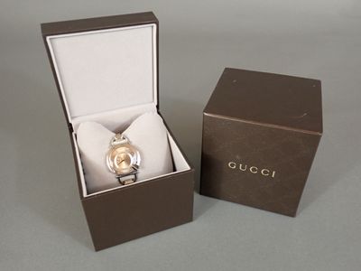 a box with a watch inside of it on a table