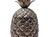 a close up of a metal pineapple on a white background