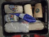 a basket full of bottles of beer and a toothbrush in it