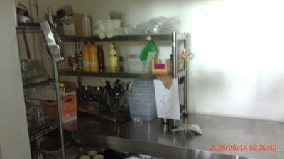 an image of a commercial kitchen with stainless steel appliances