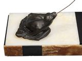 a sculpture of a mouse on a marble block