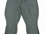 a pair of green pants with laces on the legs