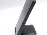 a cell phone that is sitting on top of a stand