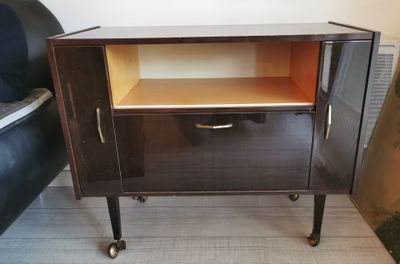 an image of a small cabinet with a drawer on wheels