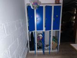 two blue lockers in the hallway of a building