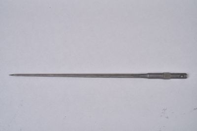 a small knife that is laying on a white surface