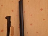 two black poles that are next to each other on a wall
