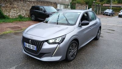 a silver car that is parked on the side of the road