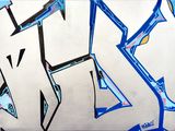 a painting of graffiti on the wall of a building