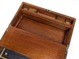 a small wooden box with a book inside of it