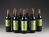 six bottles of red wine are lined up in a row