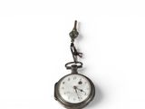 a small pocket watch hanging from the side of a wall