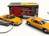 two toy cars that are connected to a computer mouse