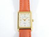 an image of a close up of a wrist watch on a white surface