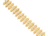 a close up of a gold bracelet on a white background