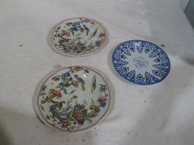 three plates that are sitting on a table