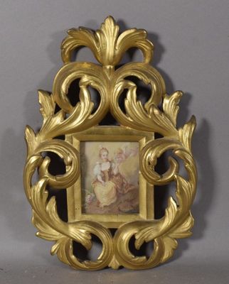 a gold frame with a picture of a woman on it