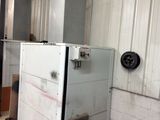 an image of a room with a refrigerator in it