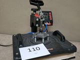 a close up of a machine on a table with a sign on it