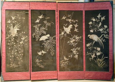 four panels with birds and flowers on them on display