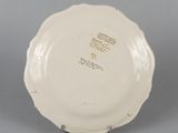 underside view of a plate showing the inscription on the plate