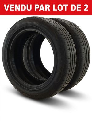 a pair of tires on a white background with the words vendu par lot de 2