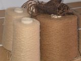 several rolls of yarn sitting on top of a cardboard box