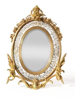 a mirror that is sitting on a stand on a white surface