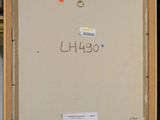 a painting on a easel with a red dot in the middle