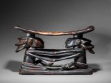 an image of a statue of a man and woman holding a surfboard