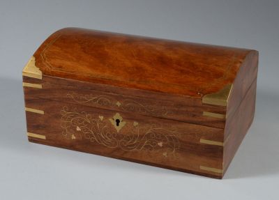 a small wooden box with a decorative design on it