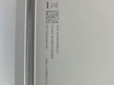 a close up of a piece of metal with a sticker on it