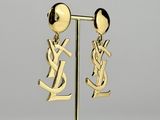 a pair of gold earrings with the letter y on them