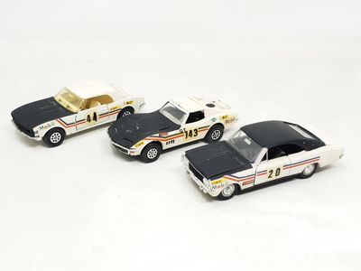 three toy cars that are sitting next to each other