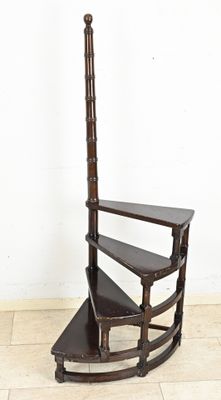 a wooden shelf with three shelves on top of it